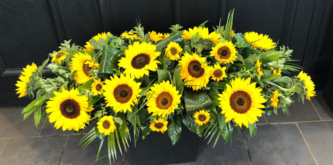Sunlit Tribute Casket Spray